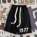Unbeatable Quality Wind Letter Printed Shorts Men's 2025 Summer Ins Trendy Brand Design Sense Drawstring Loose Sports Five Quarter Pants_viptrois.com