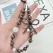 Light Luxury Style Electroplated Bow Inlaid Diamond Beads Mobile Phone Chain Student Bag Pendant_viptrois.com