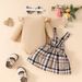 European And American Baby Autumn And Winter Striped Long Sleeved Triangle Romper + Bowknot Plaid Bear Doll Suspender Skirt + Hairband Set_viptrois.com
