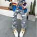 2027 Fashion American Heavy Industry Splicing Knife Cut Holes Erosion Patch Jeans High Street Hip Hop Loose Straight Micro Flare Denim Pants_viptrois.com