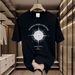 【DORAE】2026 Unisex T-shirt (100% Cotton) Black ("Pushed Aside Curtains Compass" Print & Playful Accent) – Casual Style For Friend Gathering_viptrois.com