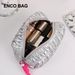 New Personalized Style Large Capacity Silver Cosmetic Bag Large Capacity Handheld Storage Bag High Grade Down Texture_viptrois.com