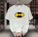 【DORAE】2026 Unisex T-shirt (100% Cotton) Off-White ("BADMAN Parody Batman" Print & Playful Accent) – Casual Style For Friend Gathering_viptrois.com