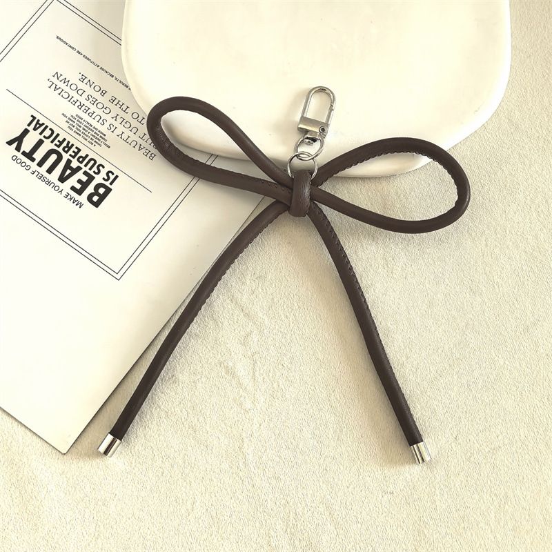 New DIY Leather Bow Lanyard Keychain Pendant Creative Headphone Bag Backpack Pendant Hand Woven Rope_viptrois.com