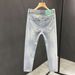 Broken Hole Jeans Men's 2025 Summer New Brand Thin Slim Fit Small Foot Trendy Rolled Edge Nine Part Casual Pants_viptrois.com