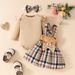 European And American Baby Autumn And Winter Striped Long Sleeved Triangle Romper + Bowknot Plaid Bear Doll Suspender Skirt + Hairband Set_viptrois.com