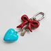 Bag Pendant A Simple And Elegant Bag Pendant With A Red Heart-shaped Metal Bow_viptrois.com