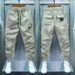 Teenage and guys little young men clothing pants solid color elastic splicing slim fitting pants trendy brand Korean version versatile harem pants_viptrois.com