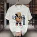 【DORAE】2026 Breathable T-shirt (Eco Cotton) Black (3D "Hooded Street Kid" Print & Tan-Blue Accent) – Pioneer Style For Weekend Getaway_viptrois.com