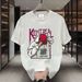 【DORAE】2026 Unisex T-shirt (100% Cotton) Black ("KEEP IT REAL Hip-Hop Figure" Print & Playful Accent) – Casual Style For Friend Gathering_viptrois.com