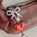 Bag Pendant A Simple And Elegant Bag Pendant With A Red Heart-shaped Metal Bow_viptrois.com