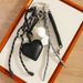 Simple Miu Series Art Blush David Statue Pendant Black Pu Love Pearl Chain High End Bag Pendant_viptrois.com