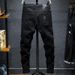 Men's Black new ripped patch jeans for men slim fit elastic small feet youth skull print fashion beggar pants_viptrois.com
